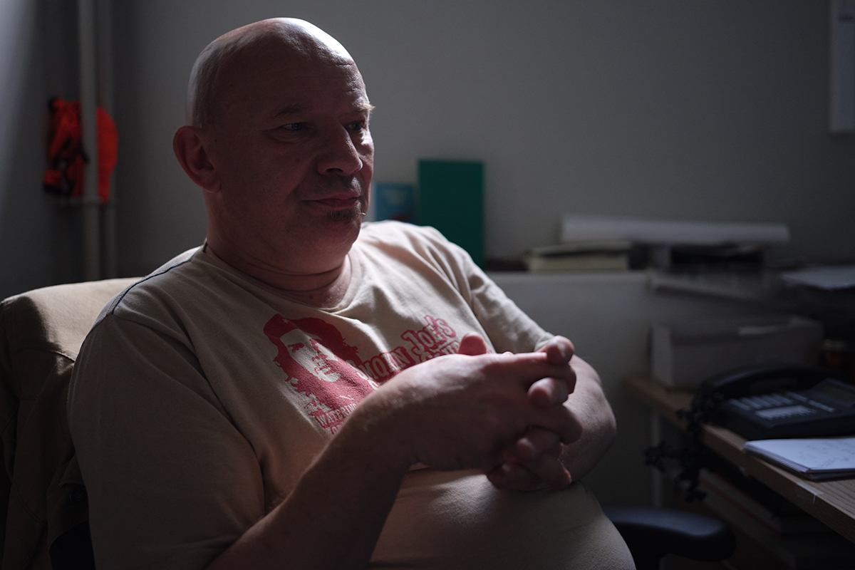 Pete, in a dark room 