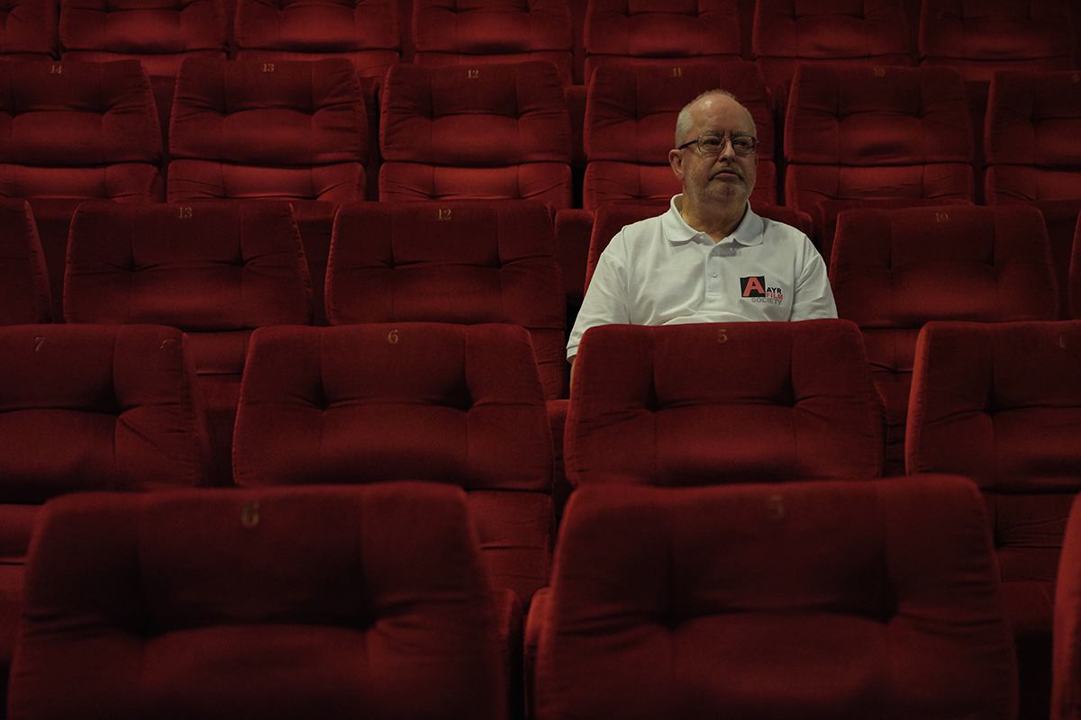 Ron looking into camera