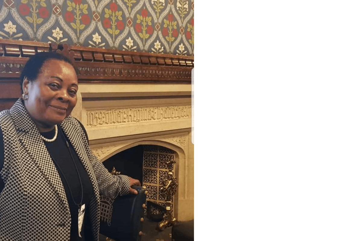 Val smiling at the camera