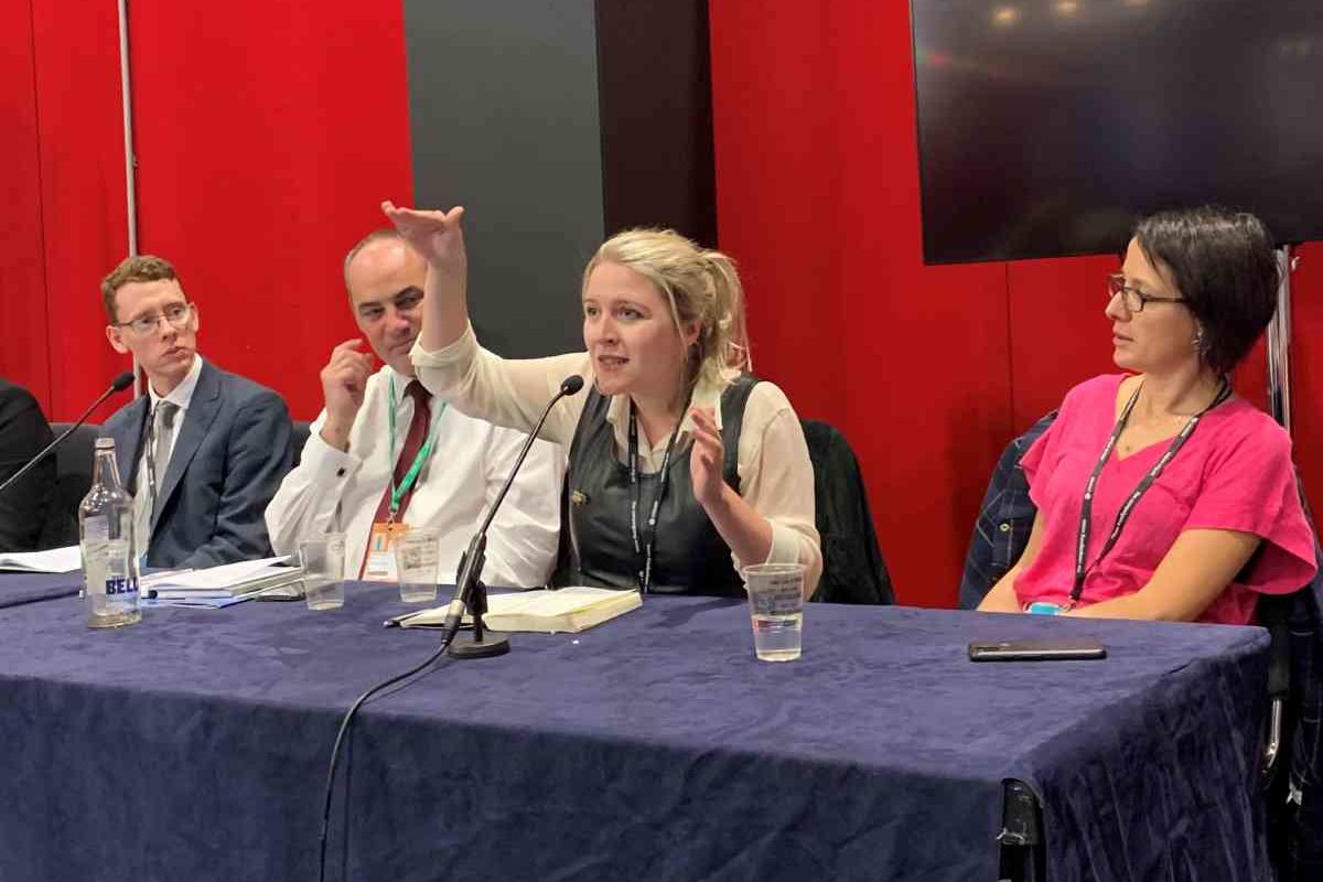 woman on panel at conference