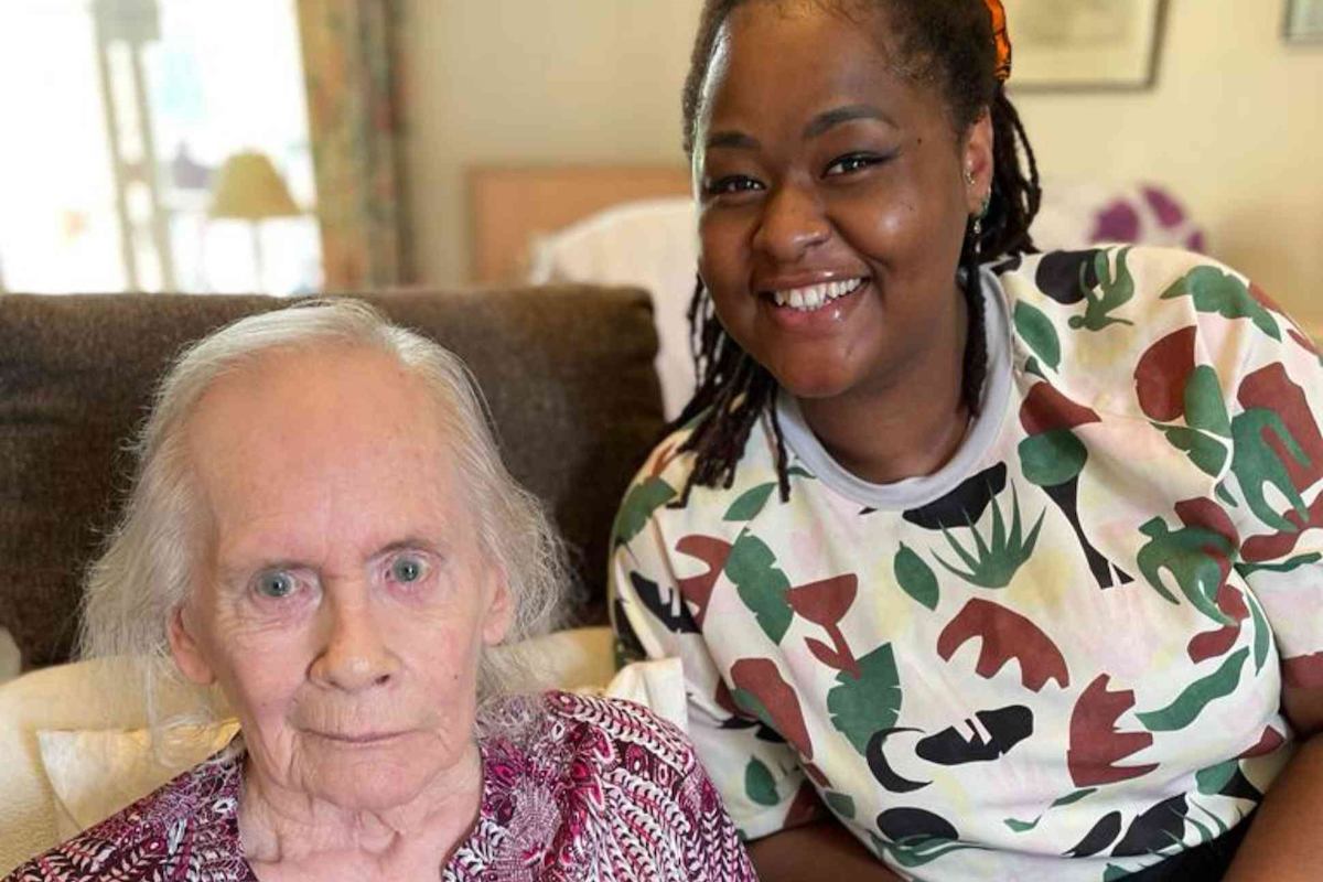 2 women smiling at camera