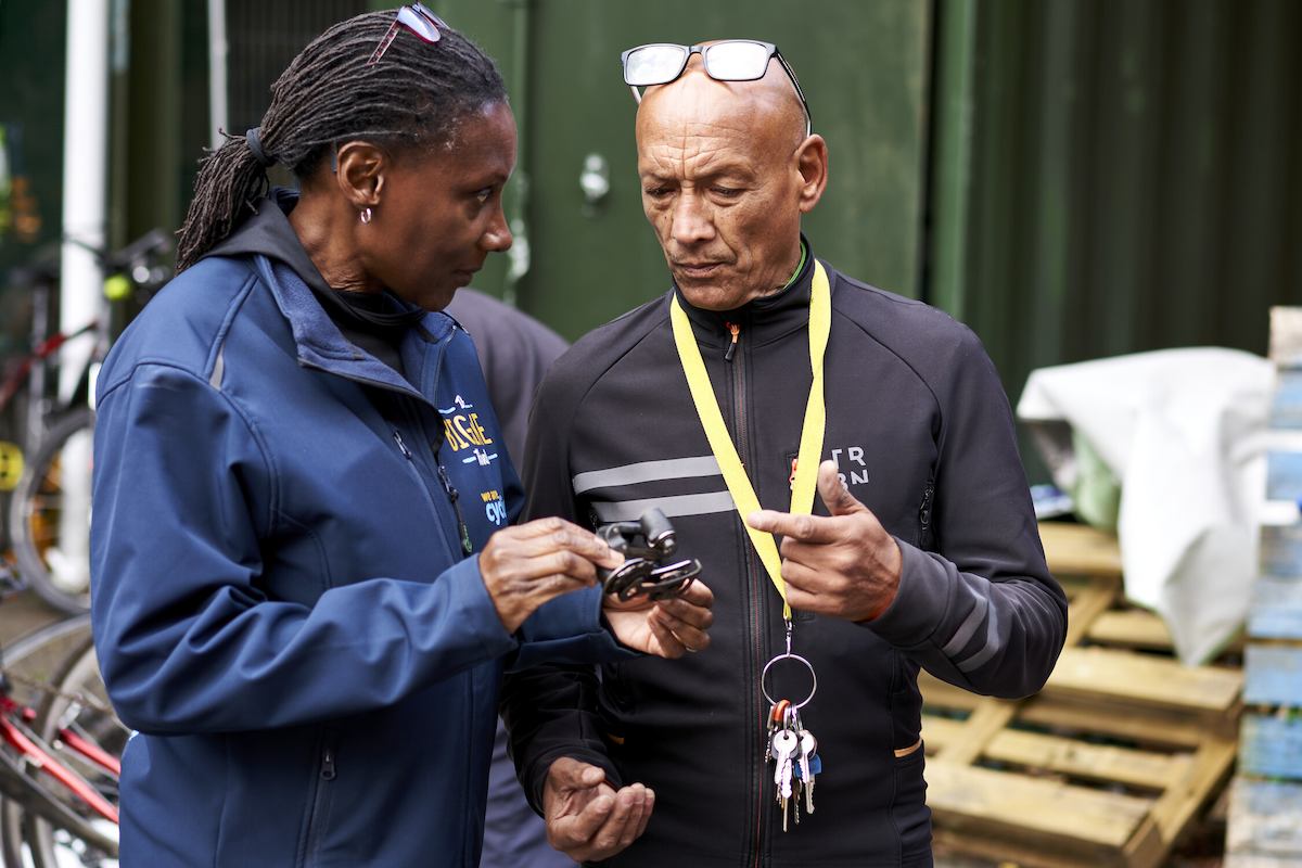 Two people talking outside