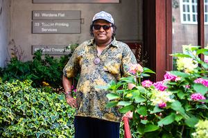 Older man standing in garden