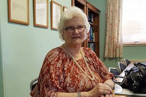 Photo of Diana by a desk