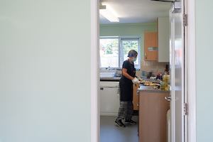 Older woman in community kitchen