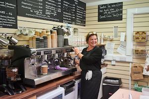 Older worker in cafe shop