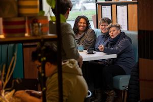 Group of older people chatting at a table