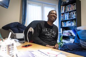 Older man at home smiling