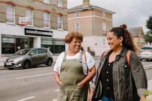 Two women walking down the street