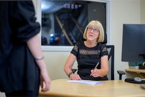 Older woman at desk