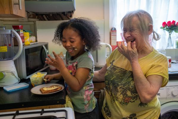 grandmother and granddaughter cooking
