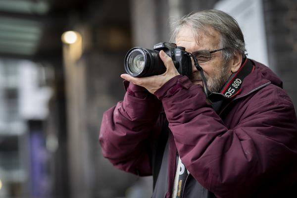 Older man using a camera