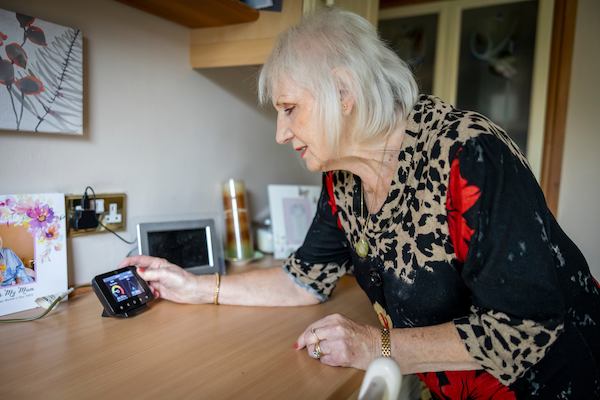 Woman checking her smart meter