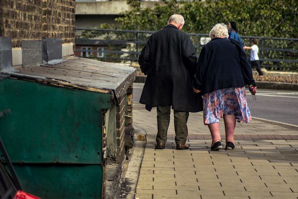 Couple walking down street, Nottingham