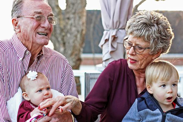 Older couple with young childrend