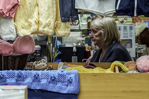 Woman shopping in Eccles, Greater Manchester