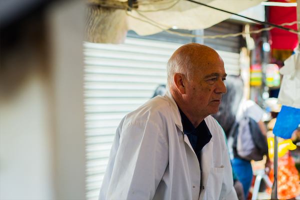 Older worker in market