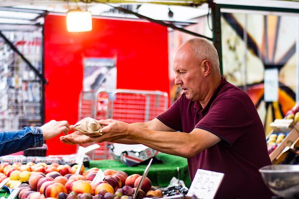 Man in the market selling fruit