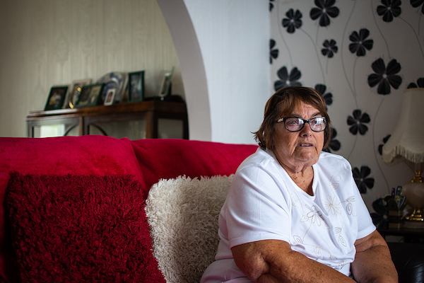 Older woman sitting on sofa