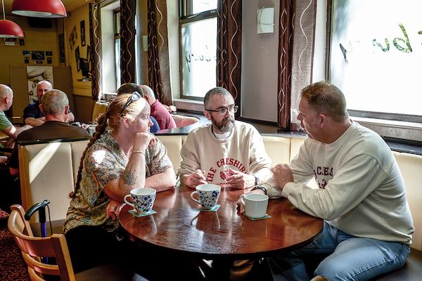 Group of people around a table in a cafe