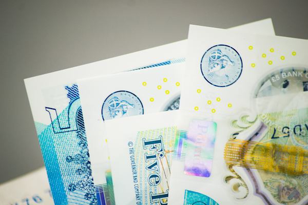Five pound paper notes.