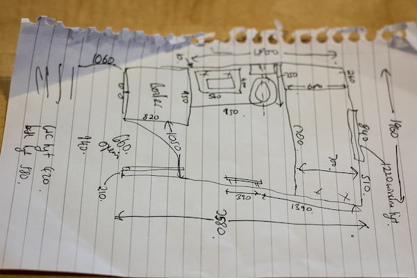 Hand drawn plans on a piece of paper.