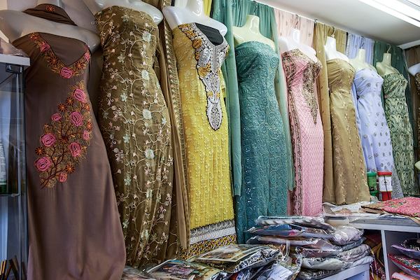 Collection of traditional East Asian dresses in a shop