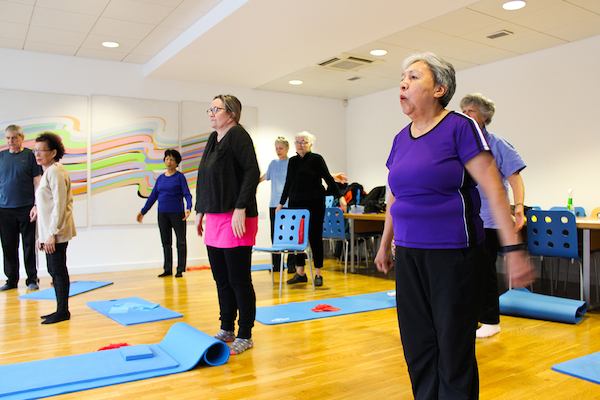 Older people in a yoga class