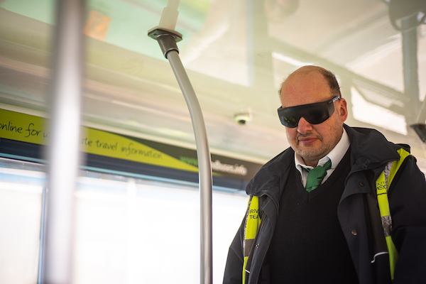 Man wearing visual impairment glassses
