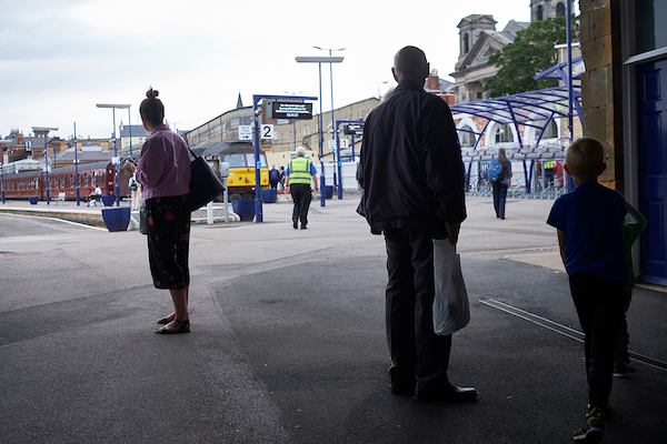 People at a train station