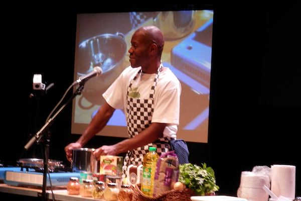 Rupert in a kitchen on stage