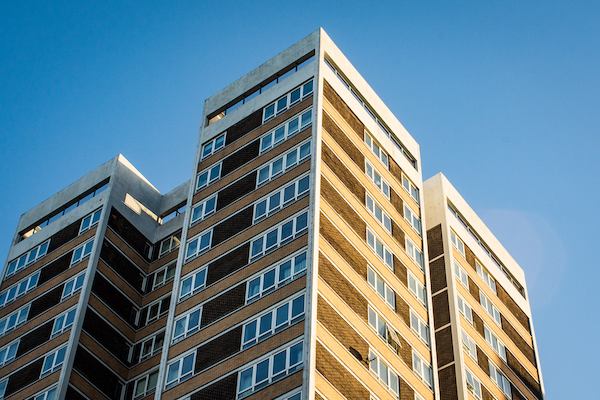 A group of high rise flats in the sunshine