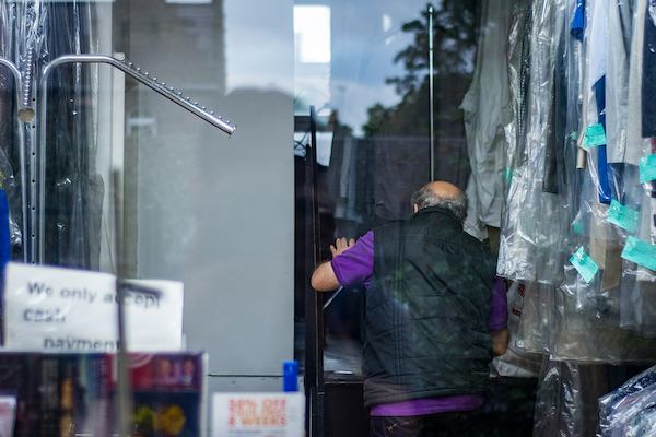 Older man in dry cleaner
