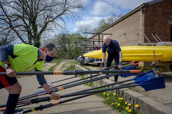 Older man preparing rowing boat