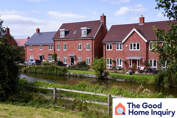 row of houses by a river