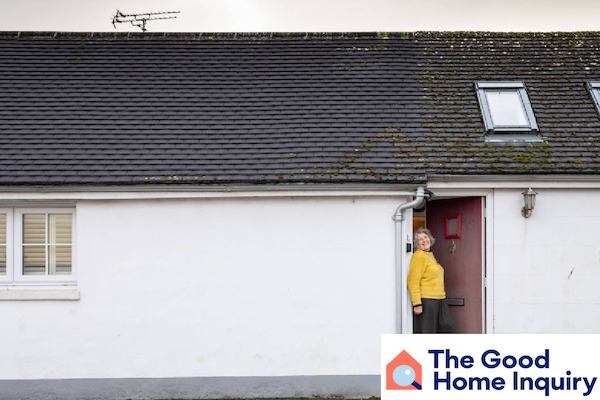woman stands in front of bungalow