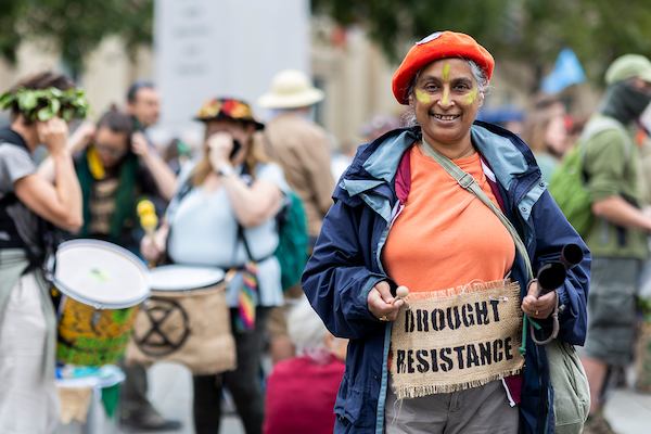 Older activist smiling at camera