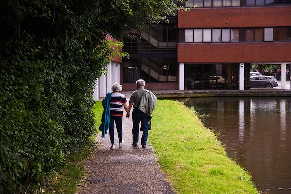 older couple walking outside