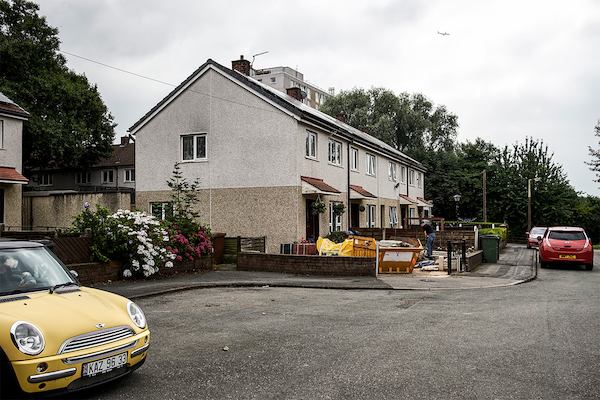 row of houses with cars outside