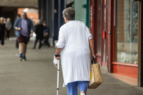 older woman walking down the street