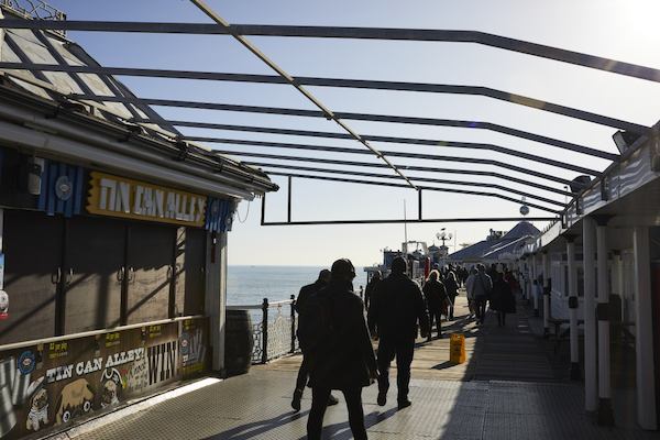 people walking on brighton pier