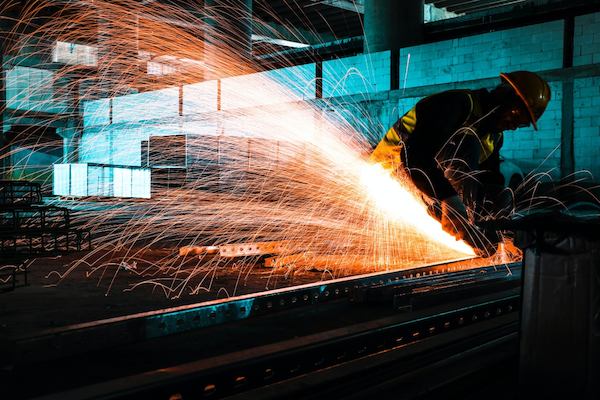 Worker uses welding machine