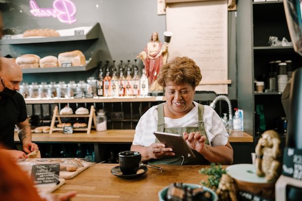 older woman working at a cafe
