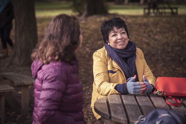 older women sitting talking together