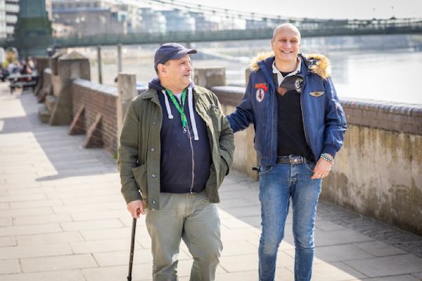 two men walking and talking