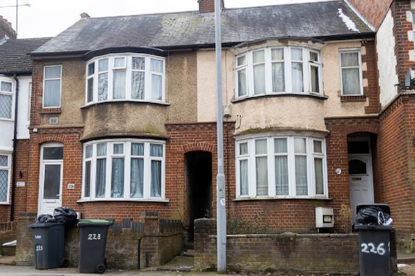 A row of houses with bay windows