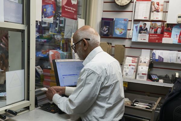 an older worker in the post office