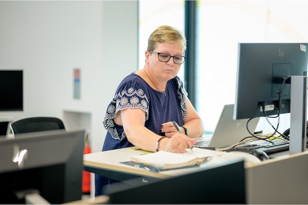 older woman working in an office