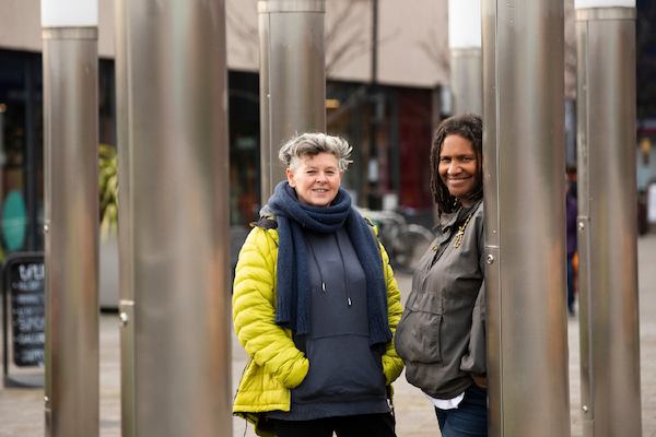 two women standing outside