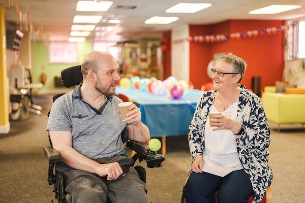 Older woman caring for an older man